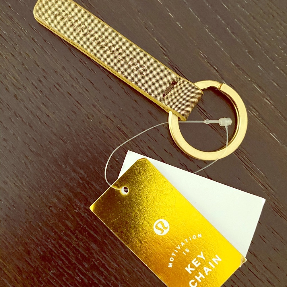 “Highly Meditated” gold lululemon keychain